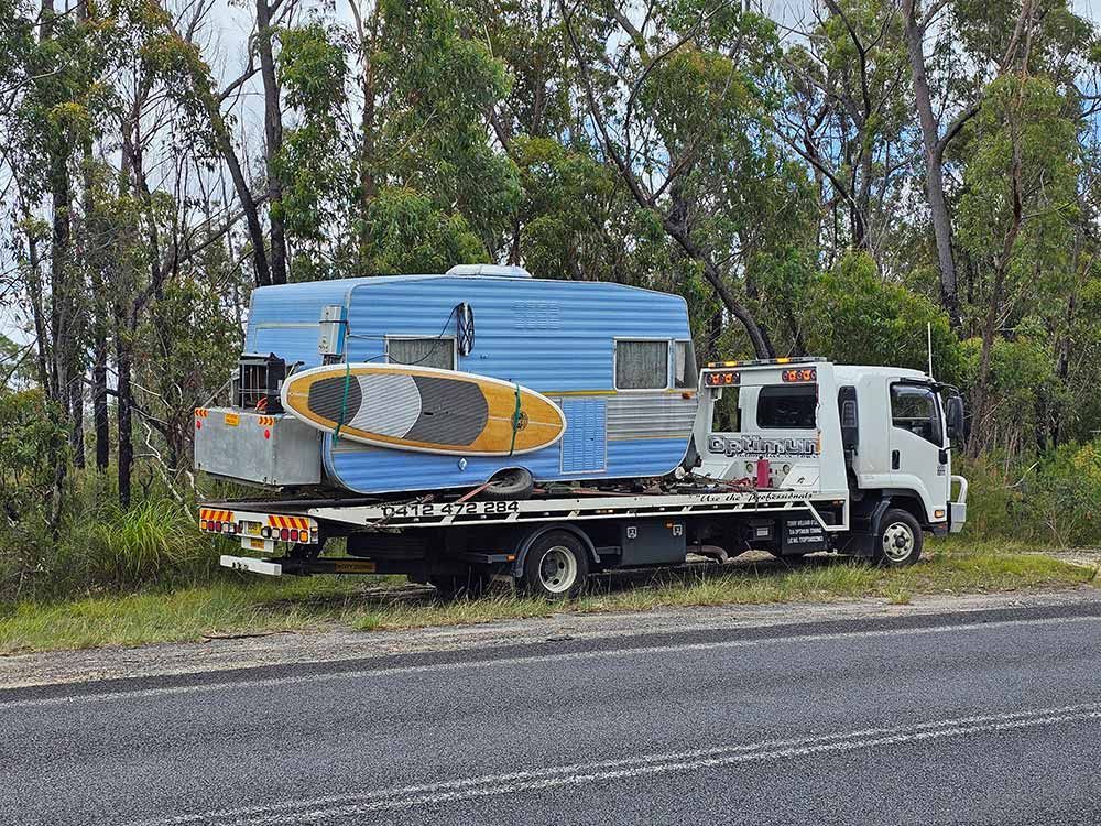 Camper Trailer With Surfboard Towing — Optimum Towing in Bomaderry, NSW