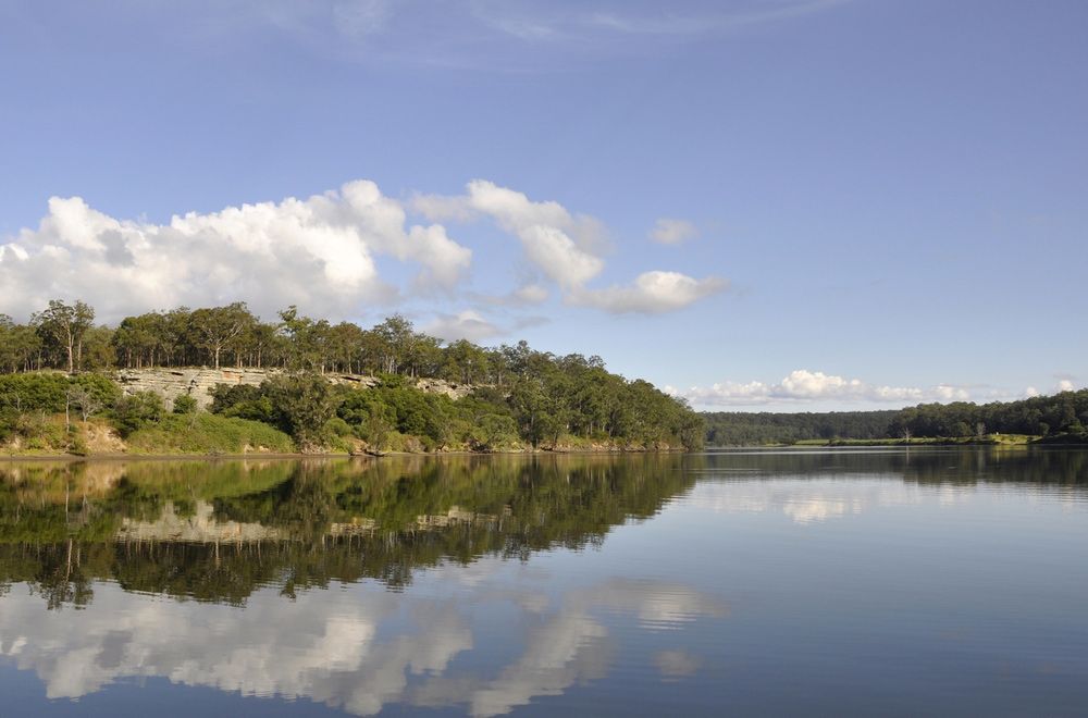 River, Clouds And Shoreline Reflection On The Water — Optimum Towing in Shoalhaven, NSW