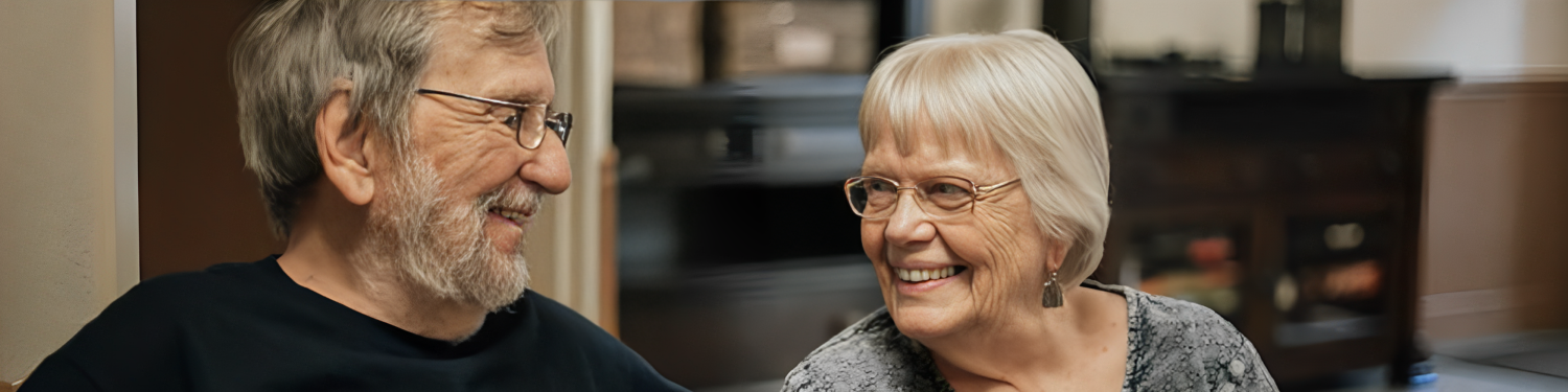 elderly folks holding hands