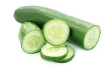 A cucumber is cut in half and sliced on a white background.