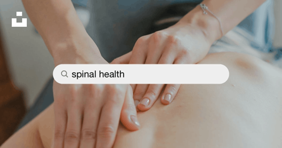 A person is getting a massage with a search bar that says spinal health.