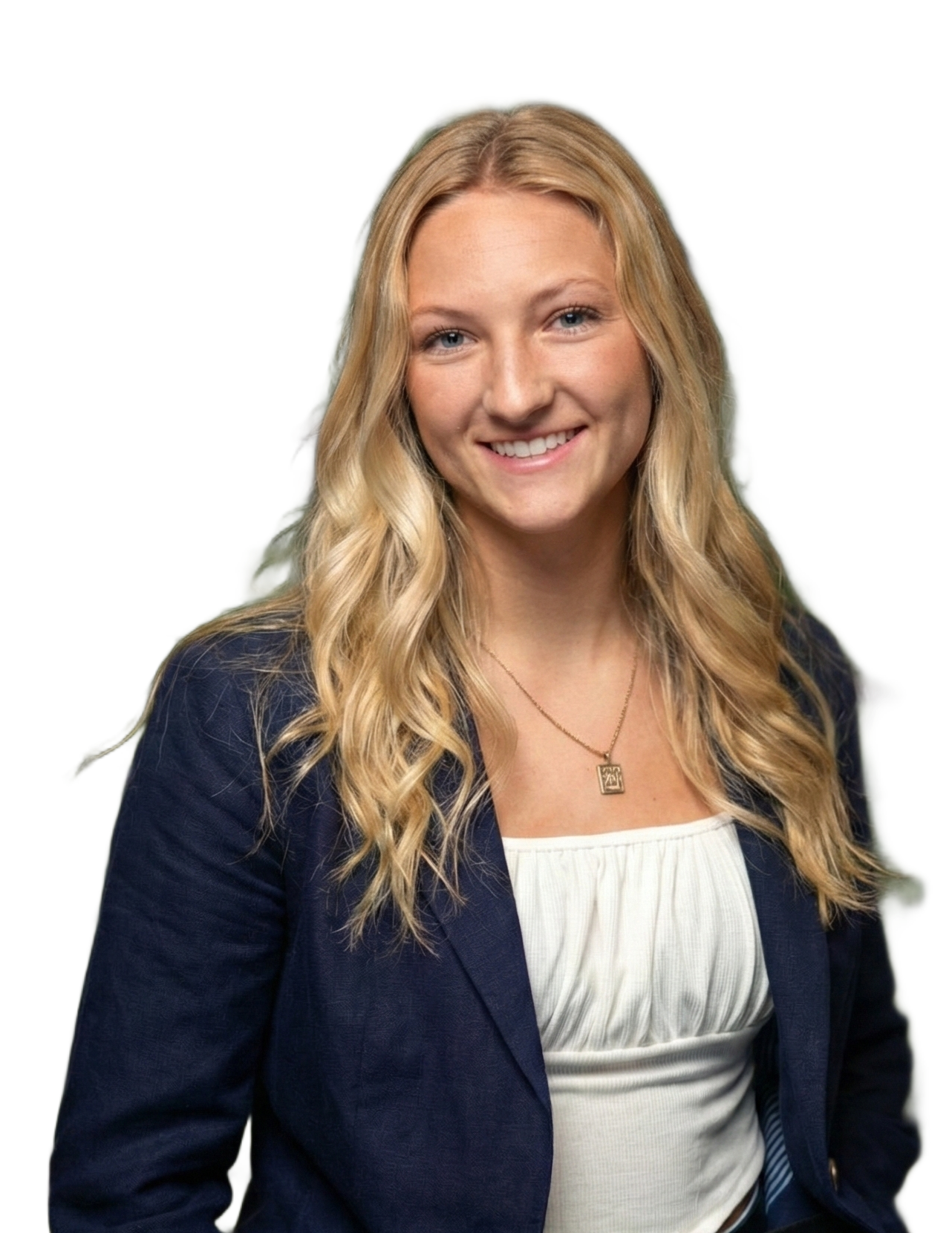 Smiling woman in a navy blazer and white top against a white background