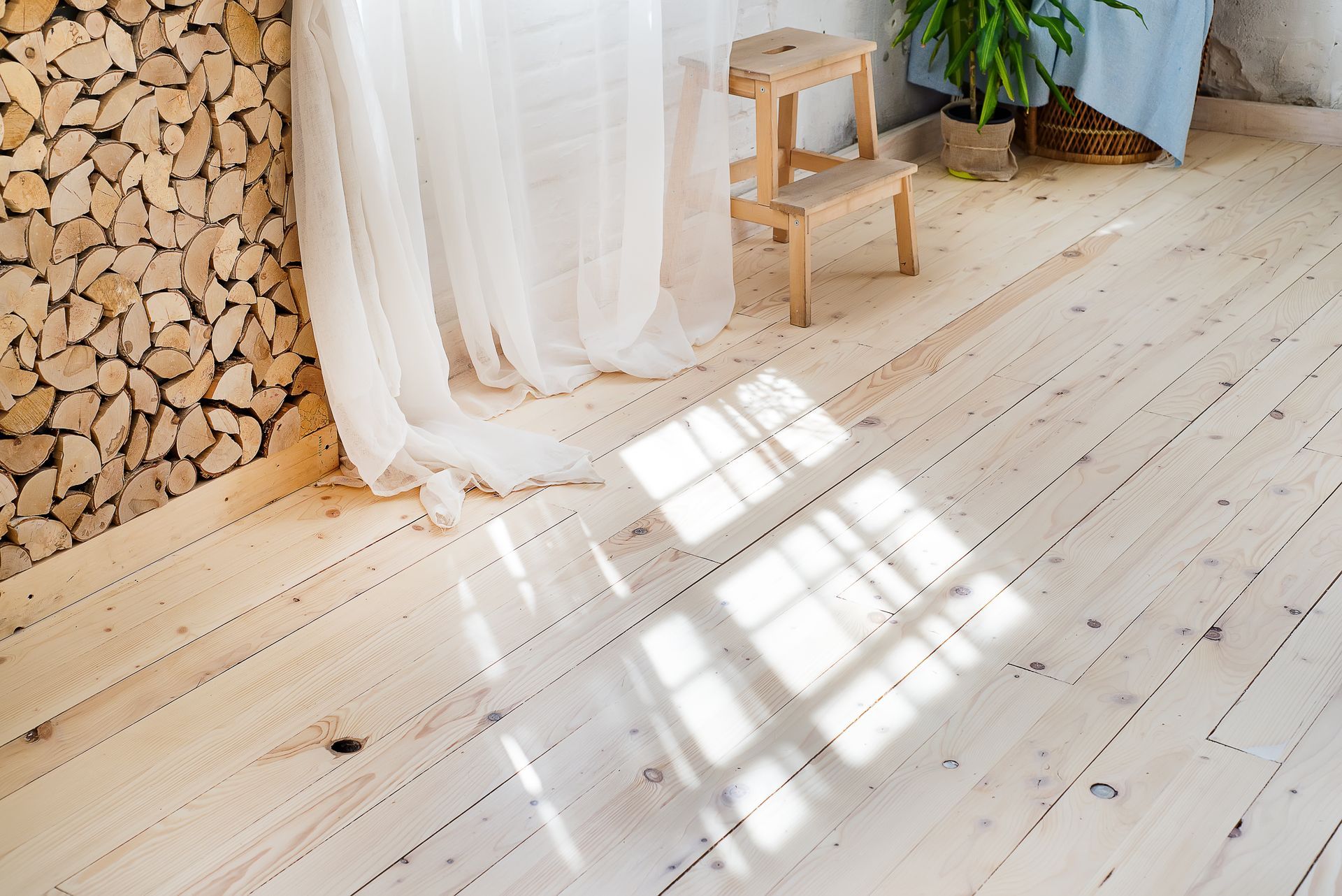 Glass windows with white curtains in clean home, dust-free sanding by All Brite Floors Houston
