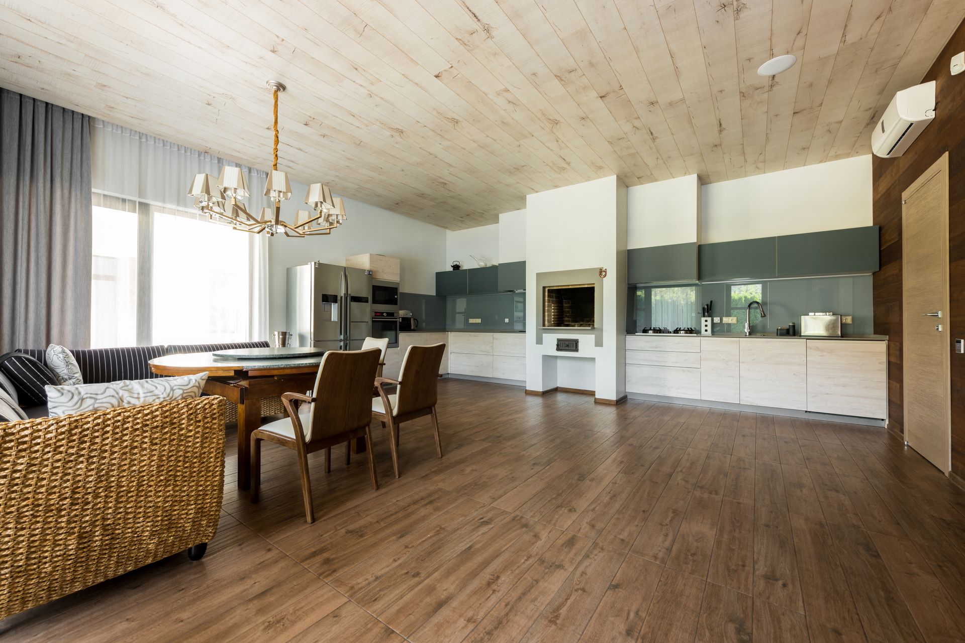 Stylish kitchen and dining area with LVP flooring by All Brite Floors Houston