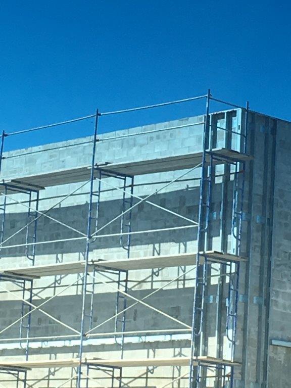 Building With Metal Scaffolding — Miami, FL — J & M Scaffolds of Florida