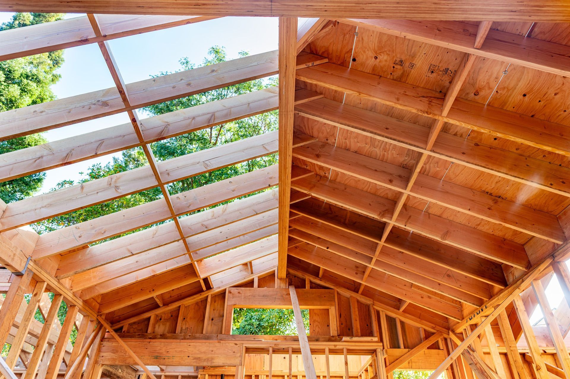 S. R. Freeman crew coordinating structural steel and wood framing on a custom home