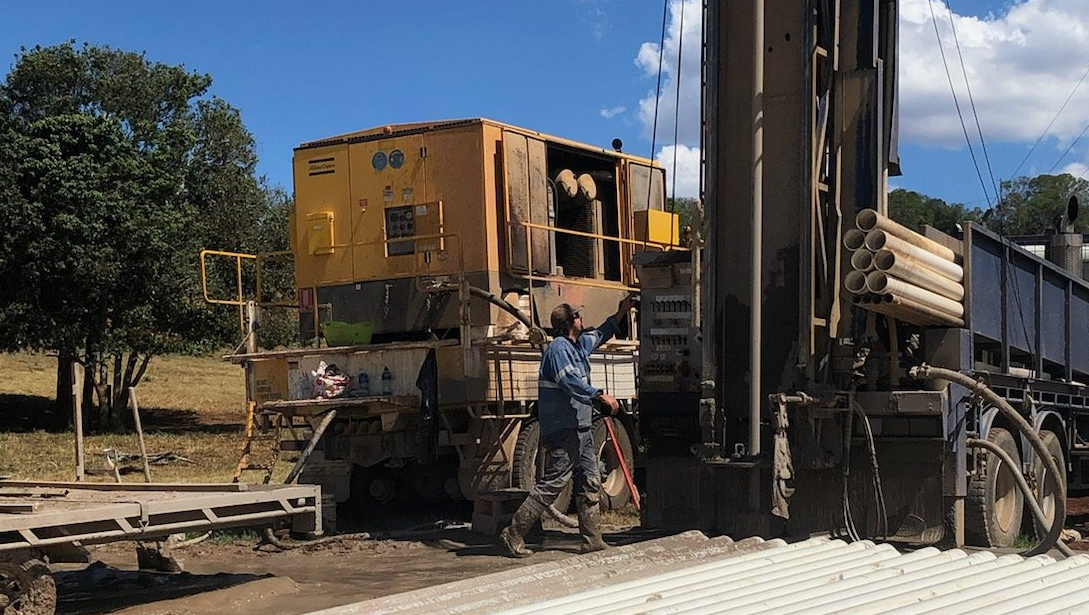 man operating drilling rig