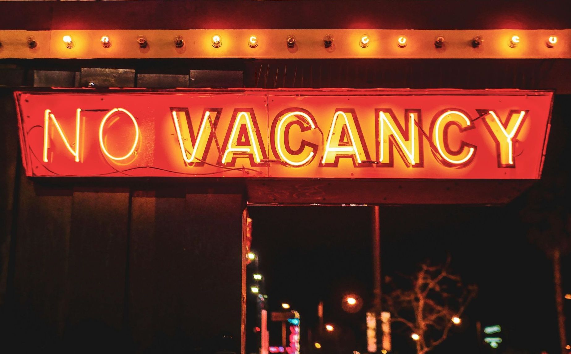 A red neon sign reading