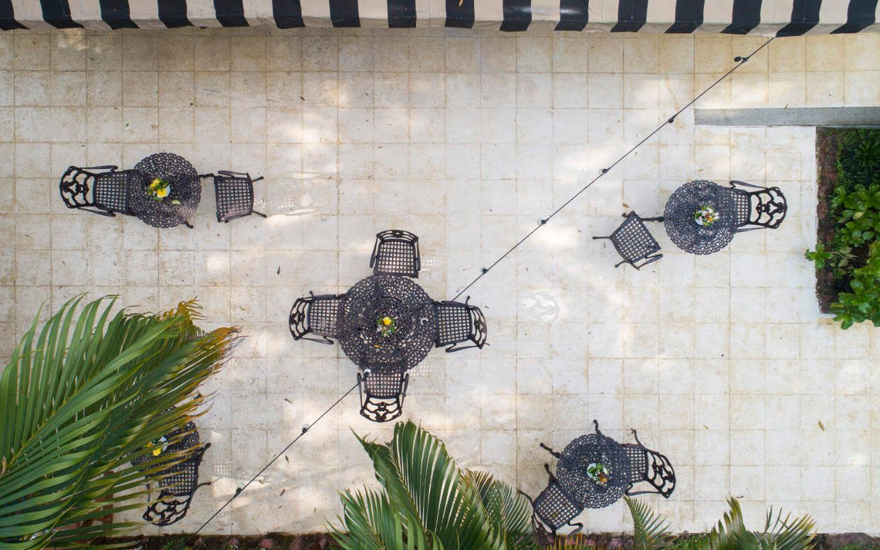 An aerial view of a patio with tables and chairs