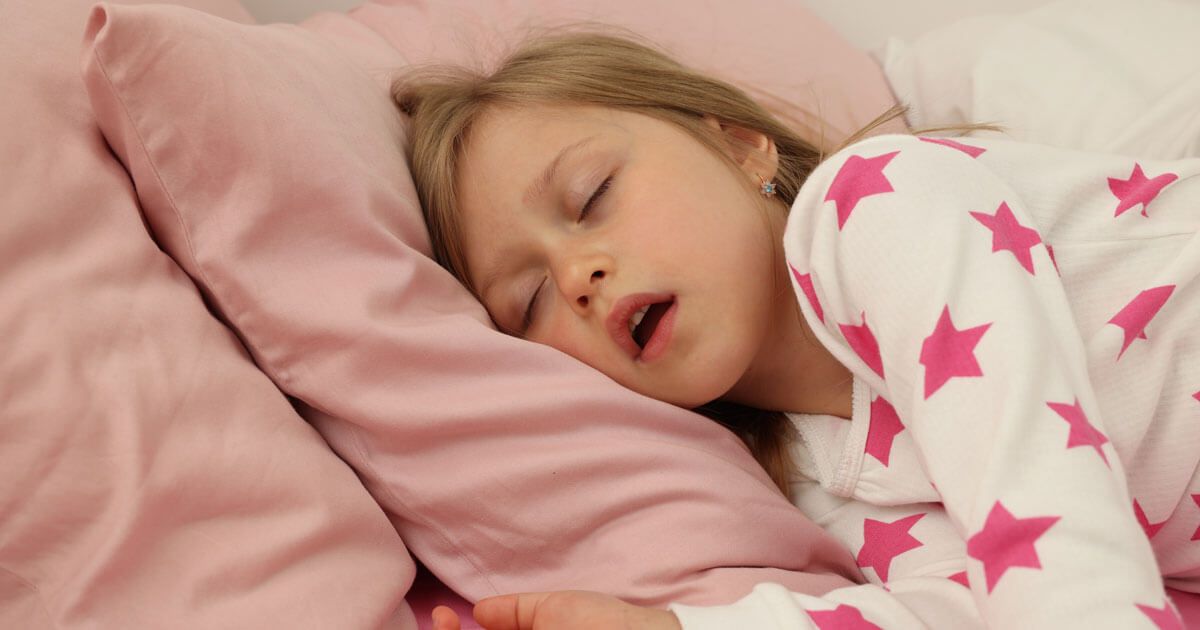 Sleeping Child in Pink Pajamas — Trinity Beach Dental In Trinity Beach, QLD