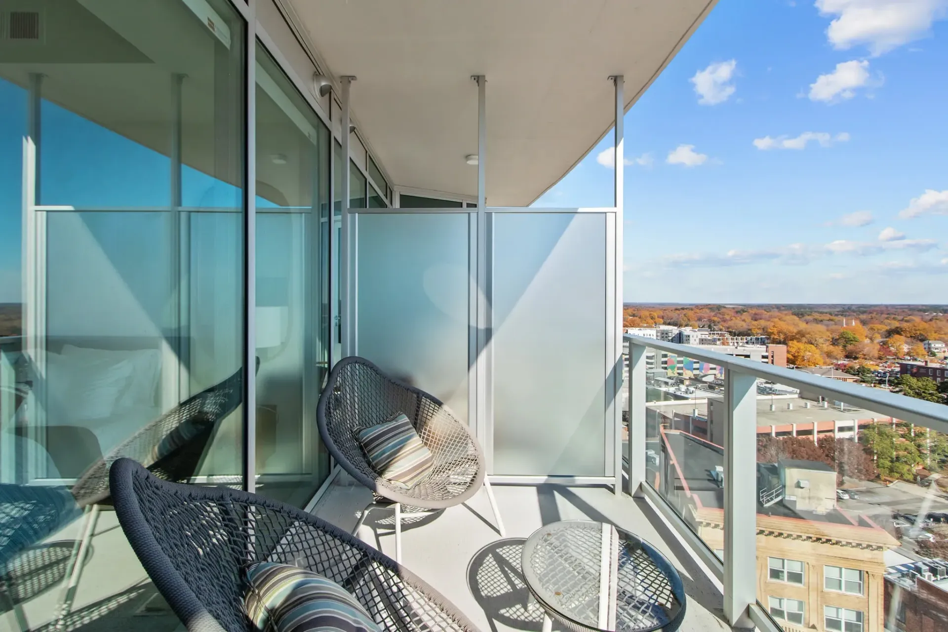 Balcony with seating overlooking city
