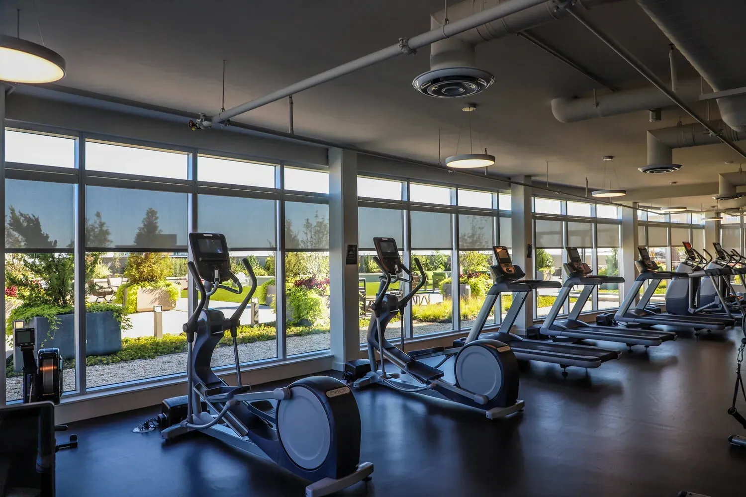 Fitness center with treadmills and elliptical machines.