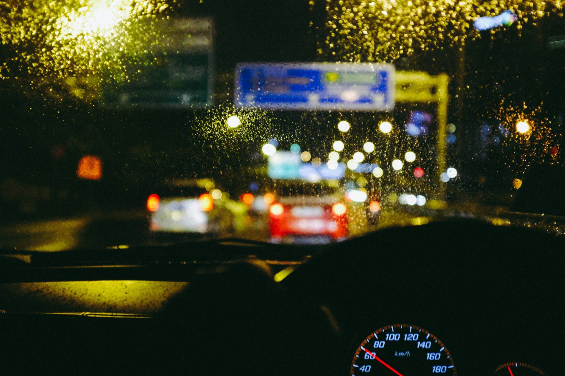 Car driving on the motor in the dark and rain.