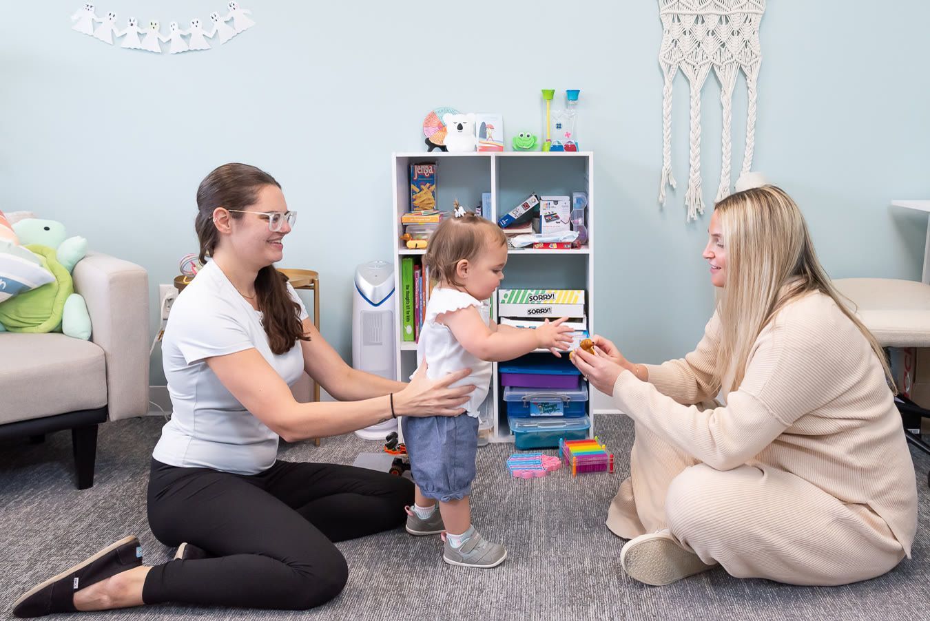 Therapist and mother play with a toddler, support after a difficult birth in Bergen County NJ