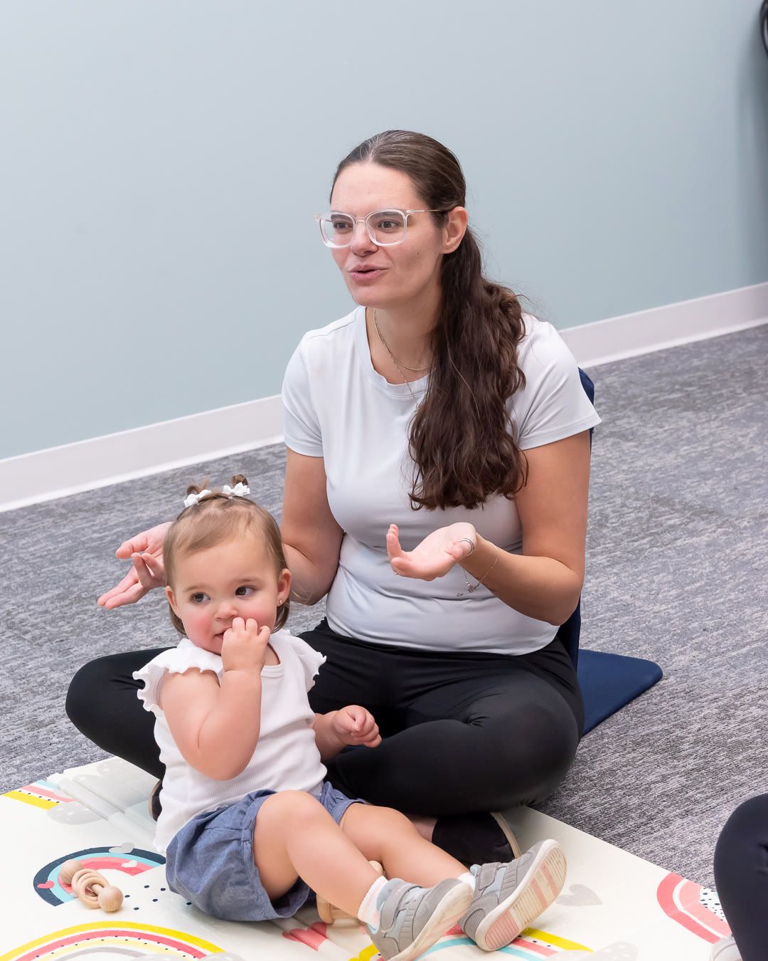 Therapist talks with a parent and toddler, perinatal OCD treatment in Bergen County NJ