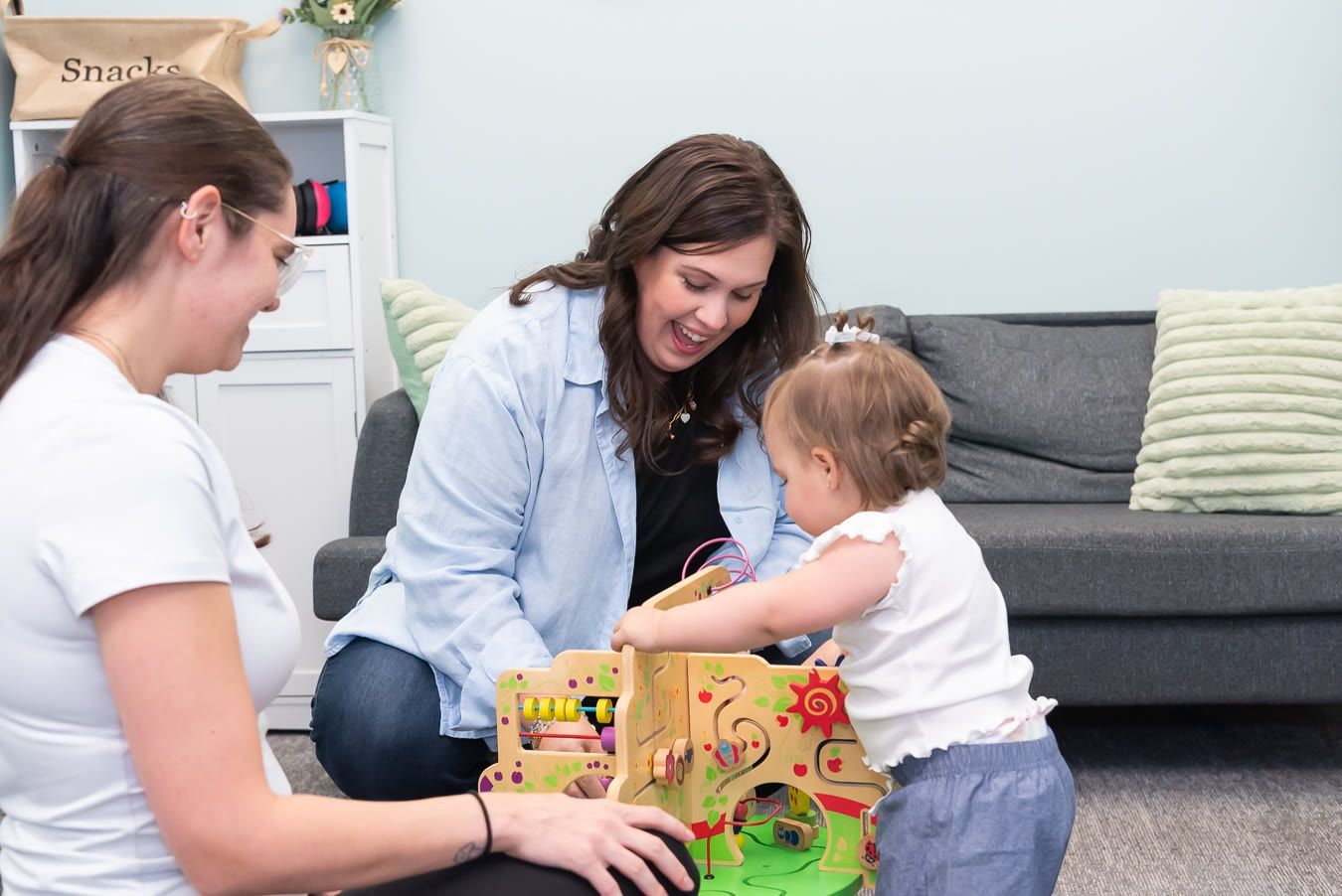 Two women play with a toddler, support for postpartum anger in Bergen County NJ