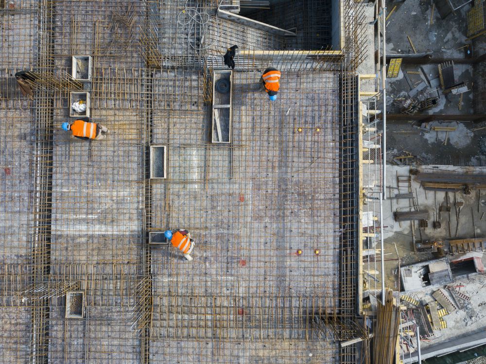 Overhead View of Construction Workers in Orange Vests — UAScend Aerial Solutions in Townsville, QLD