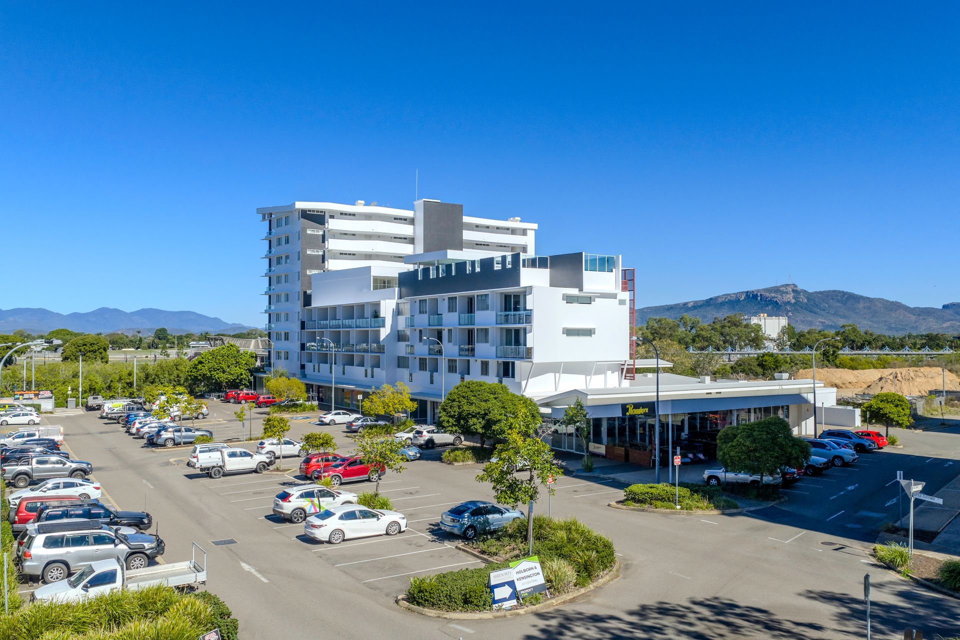 Modern Hotel and Parking Lot Under a Bright Blue Sky — UAScend Aerial Solutions in Townsville, QLD
