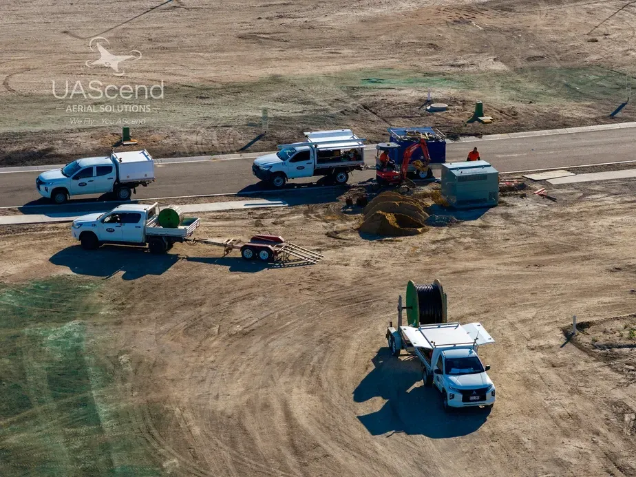Construction Vehicles and Workers at a Dirt Worksite — UAScend Aerial Solutions in Townsville, QLD