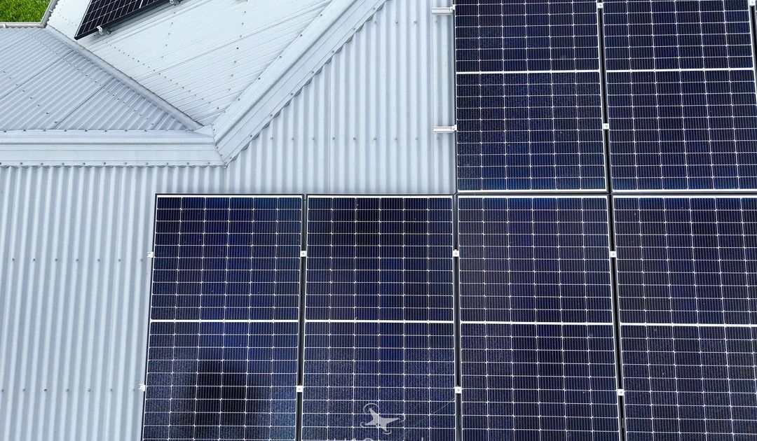 Solar Panels on a Light Gray Metal Roof — UAScend Aerial Solutions in Townsville, QLD