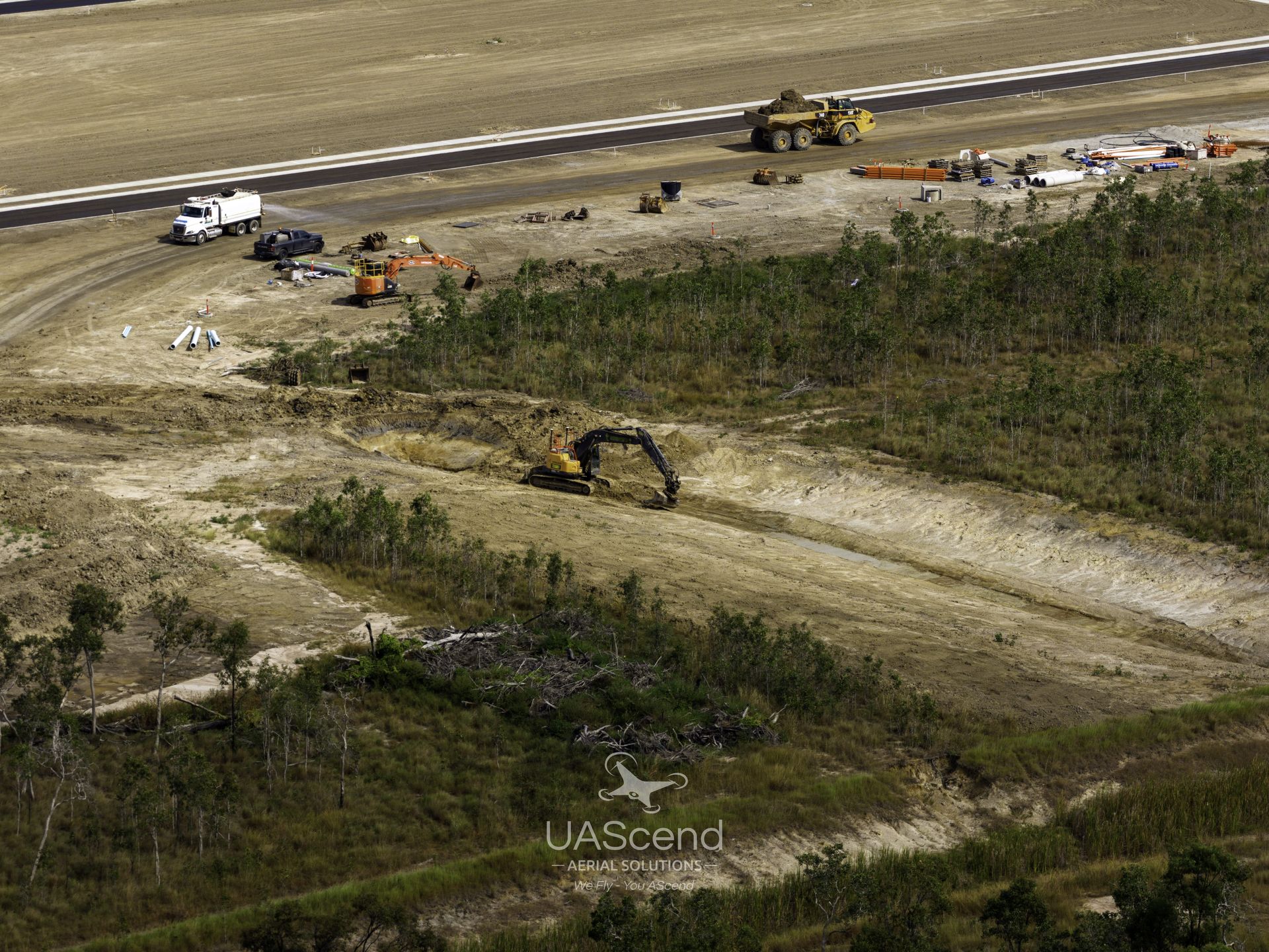 Construction Vehicles Working on a Dirt Site — UAScend Aerial Solutions in Townsville, QLD