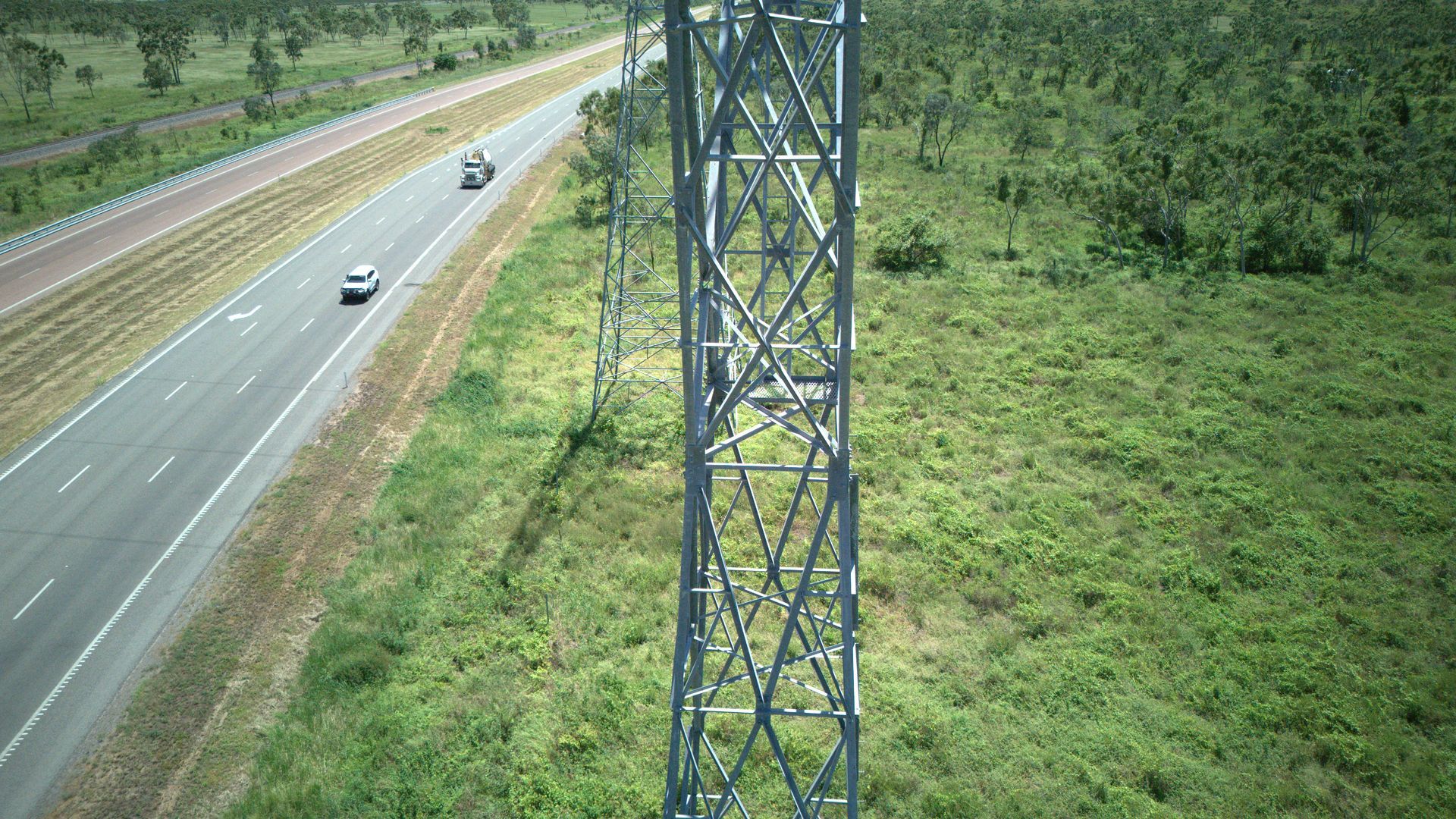 Aerial View of a Highway With Cars Beside a Green Landscape — UAScend Aerial Solutions in Townsville, QLD