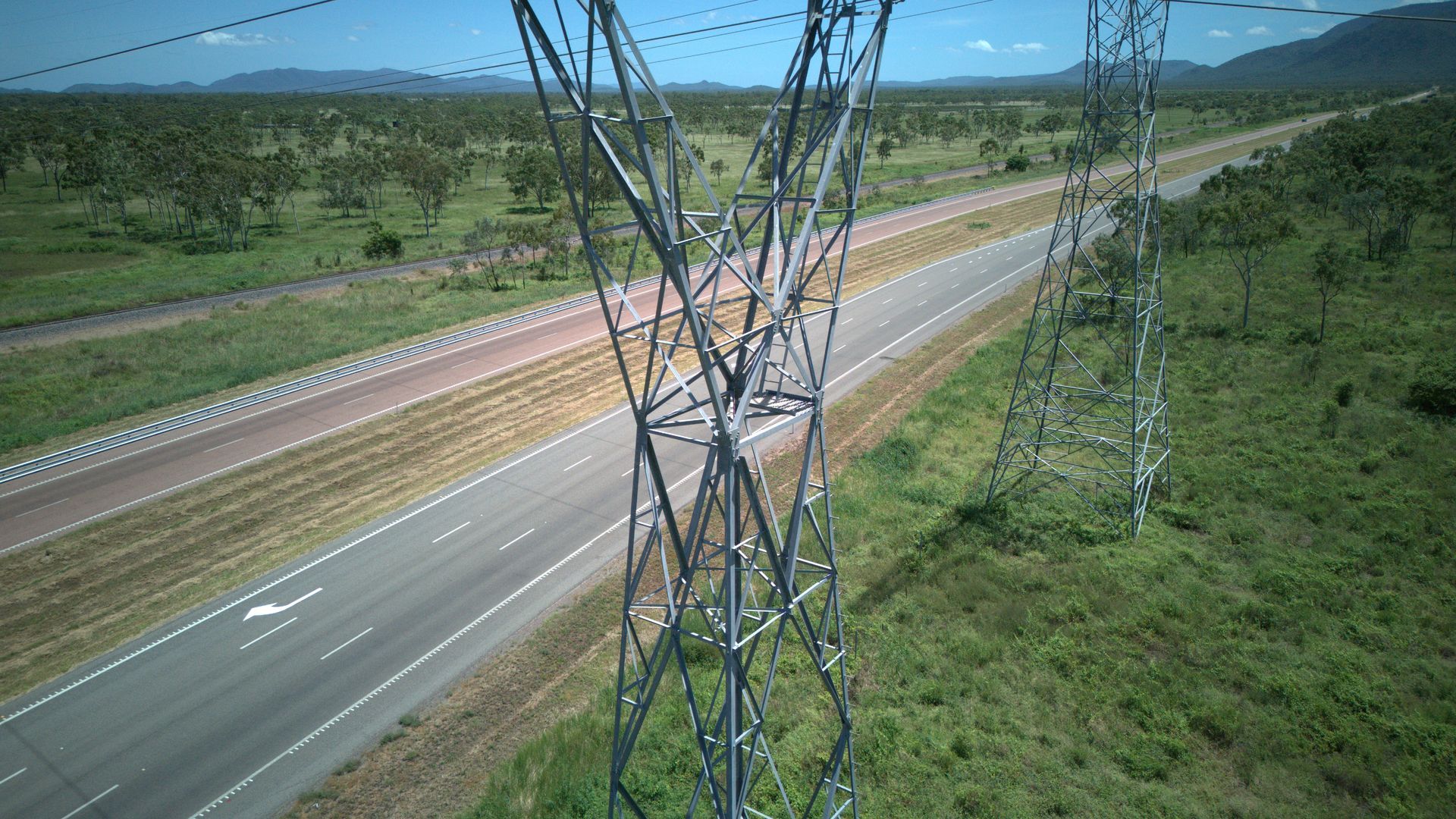 High-voltage Transmission Towers Beside a Rural Highway — UAScend Aerial Solutions in Townsville, QLD