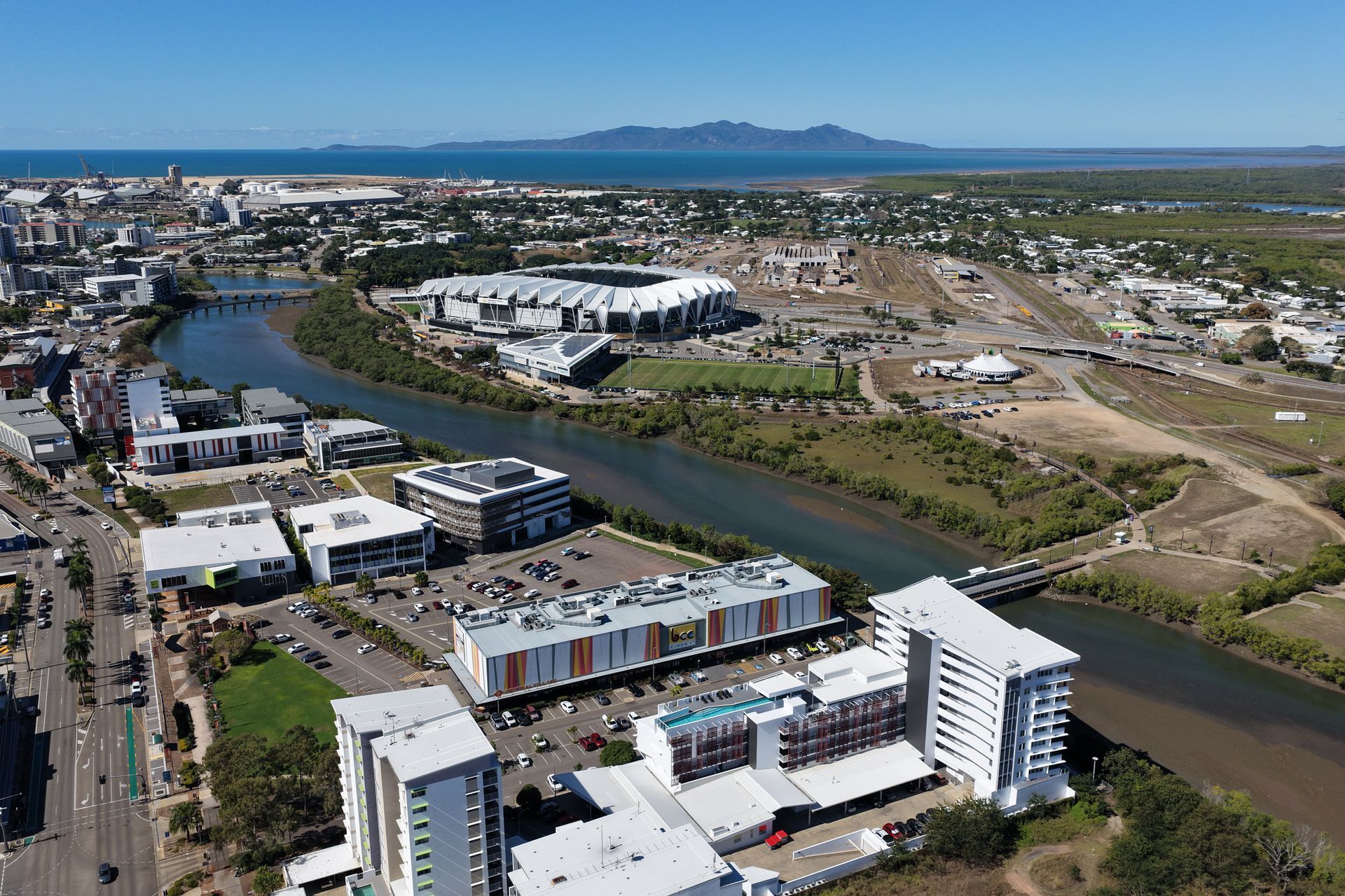 Aerial View of a Coastal Town With a Winding River — UAScend Aerial Solutions in Townsville, QLD