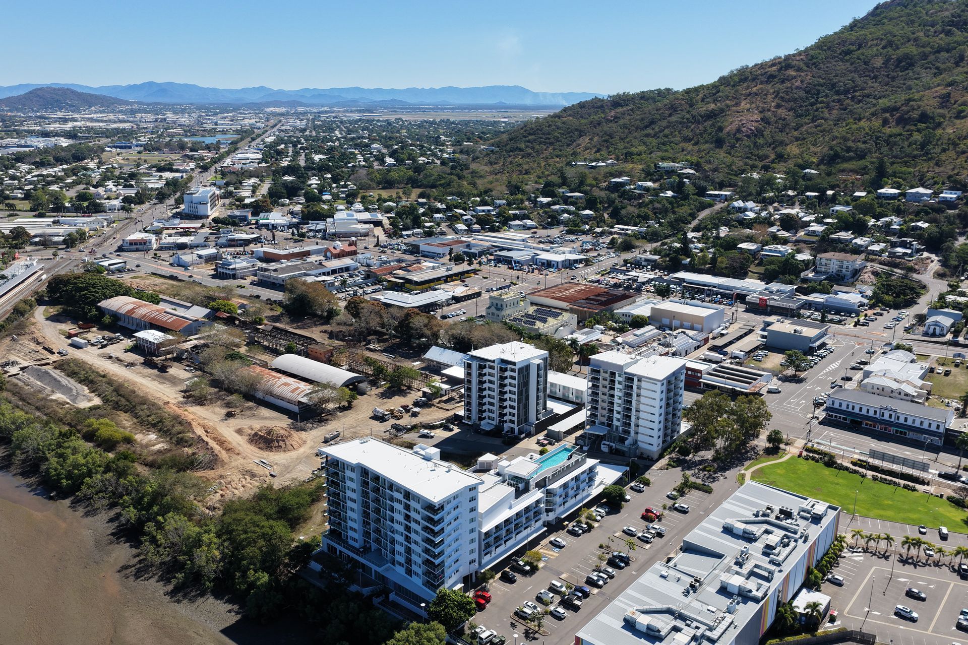 Aerial View of a Town With Blue Apartment Building — UAScend Aerial Solutions in Townsville, QLD