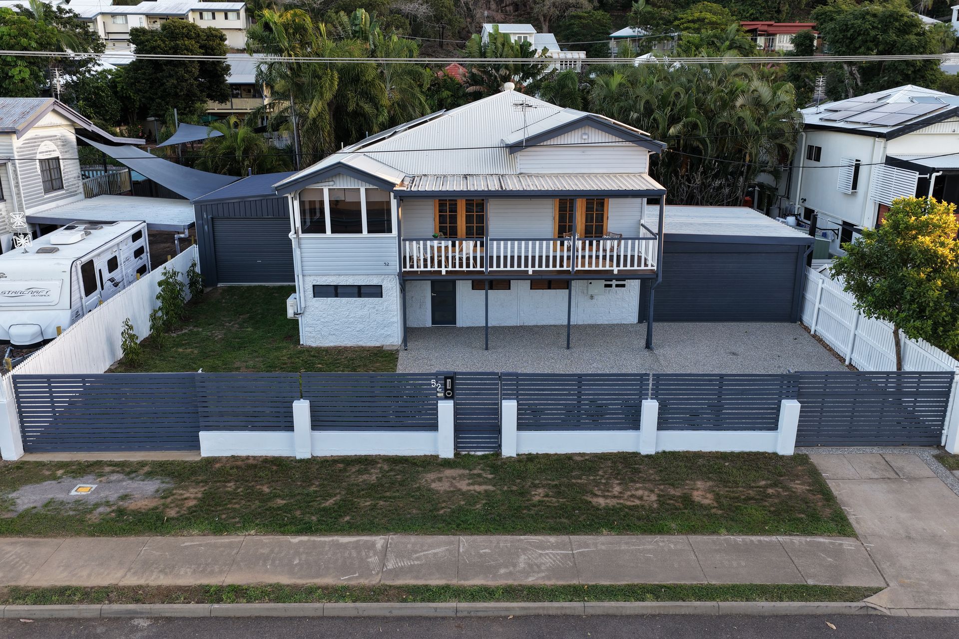 Front View of a Two-story House With a Gray Fence — UAScend Aerial Solutions in Townsville, QLD