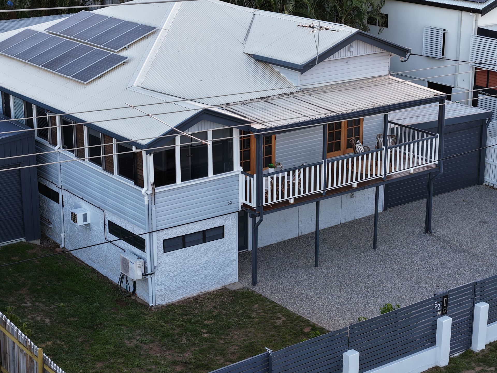 Aerial View of a White House With Solar Panels, Raised Deck — UAScend Aerial Solutions in Townsville, QLD