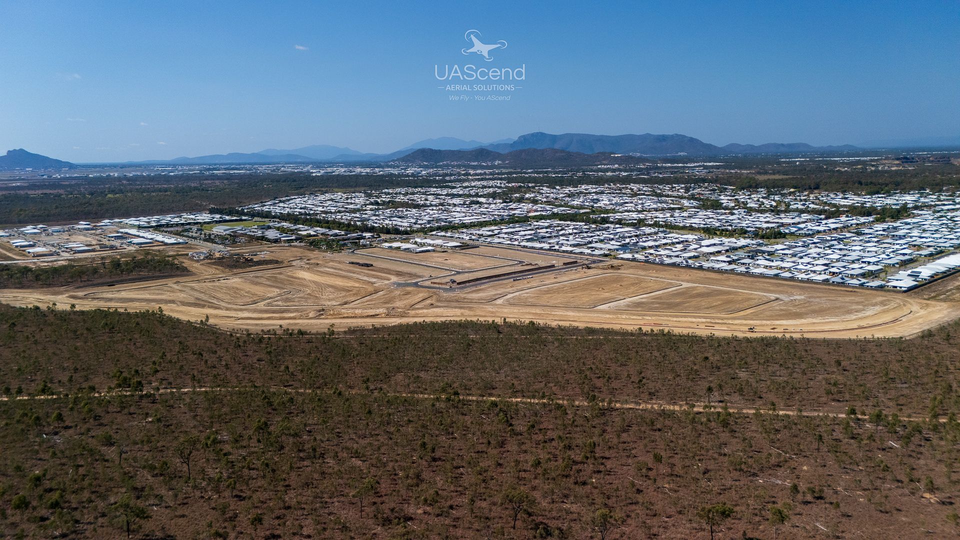 Wide Cityscape With Tan Hills in the Foreground — UAScend Aerial Solutions in Townsville, QLD