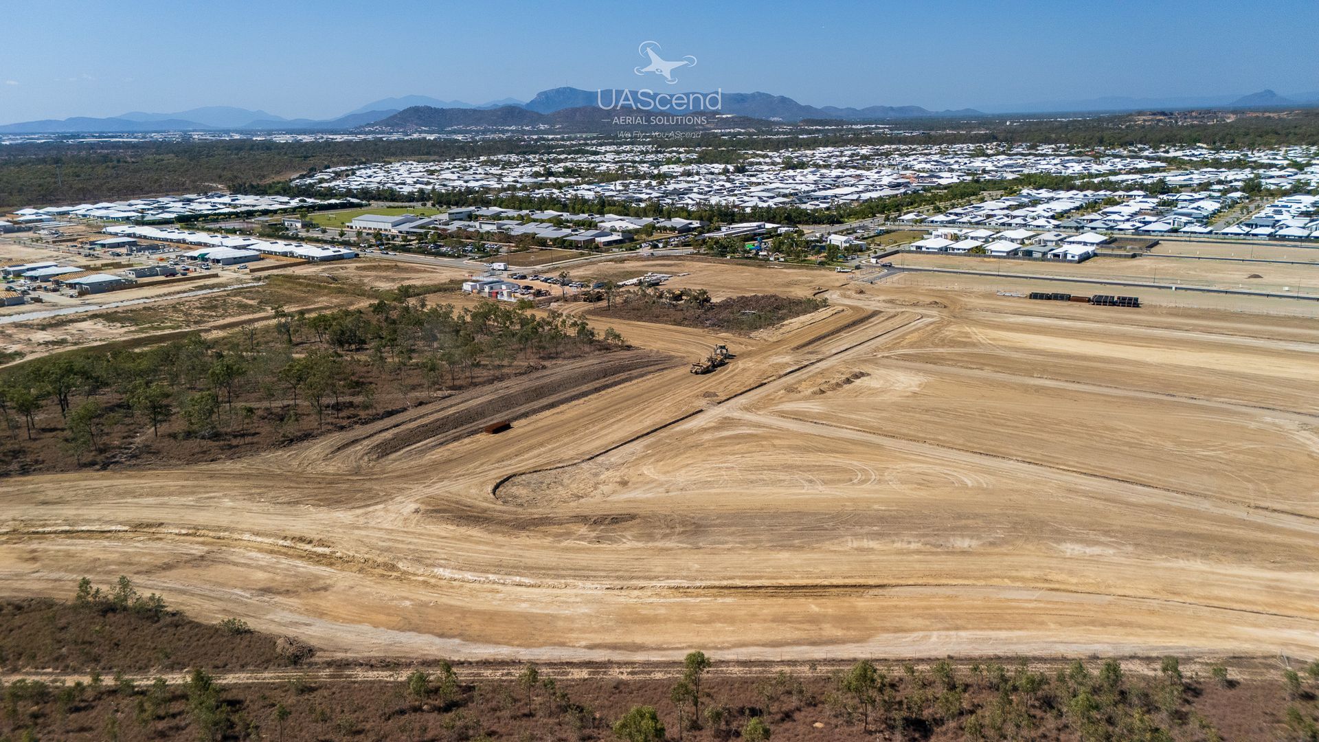 Dusty Construction Site Overlooking a Town — UAScend Aerial Solutions in Townsville, QLD