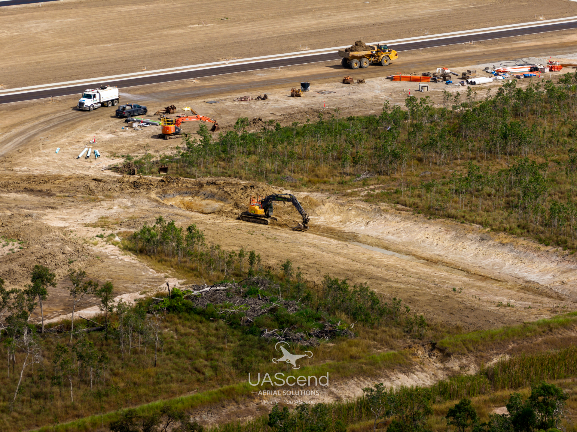 Workers in Orange Vests on a Concrete Construction Site, Seen From Above — UAScend Aerial Solutions in Townsville, QLD