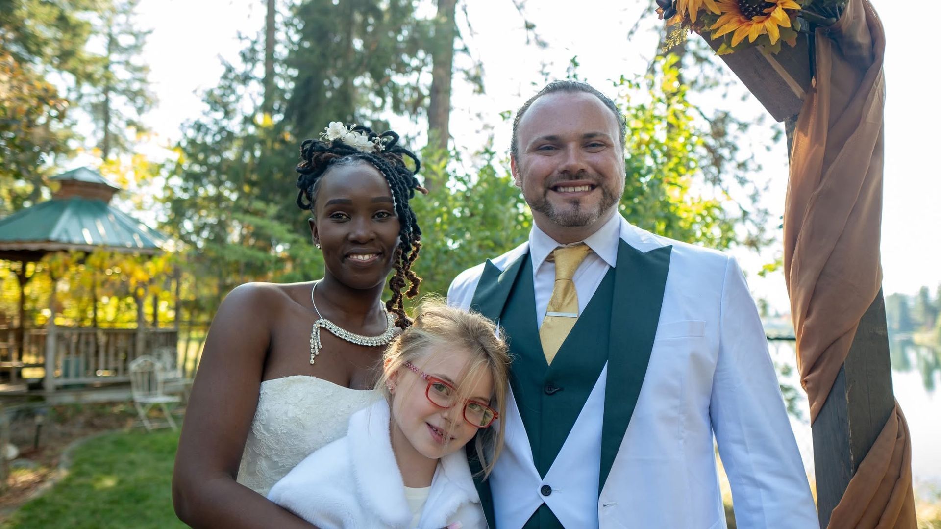 Travis Bertram with his wife and daughter