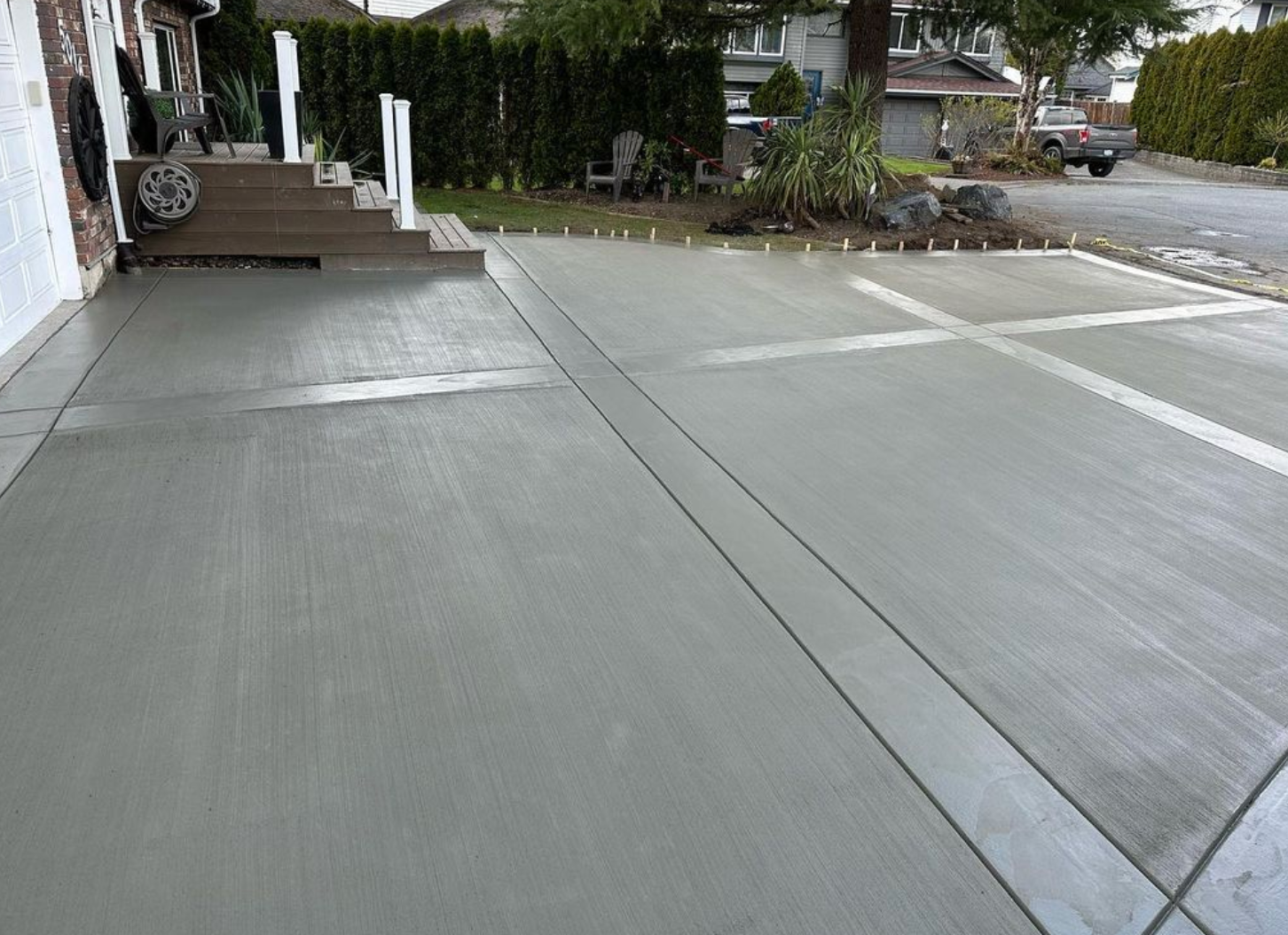 men repairing stucco on a brown siding surface