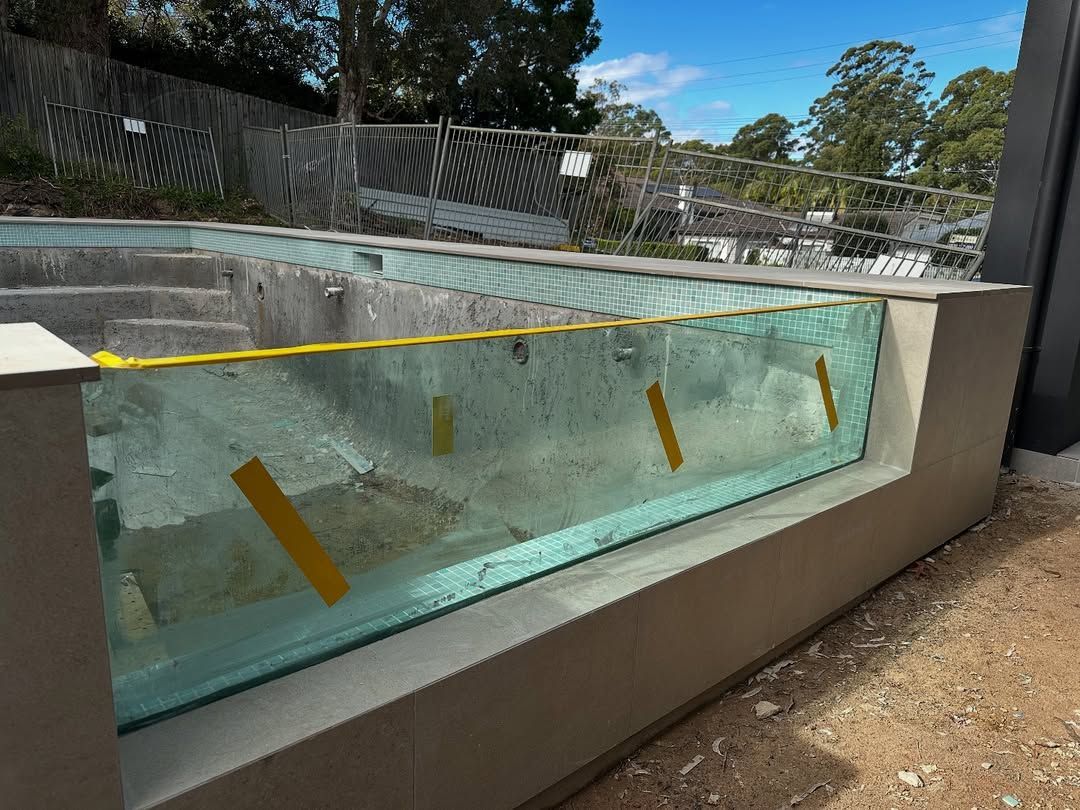 Pool Construction With Glass Panel Viewing Window — All Glass Balustrading Systems in Wetherill Park, NSW