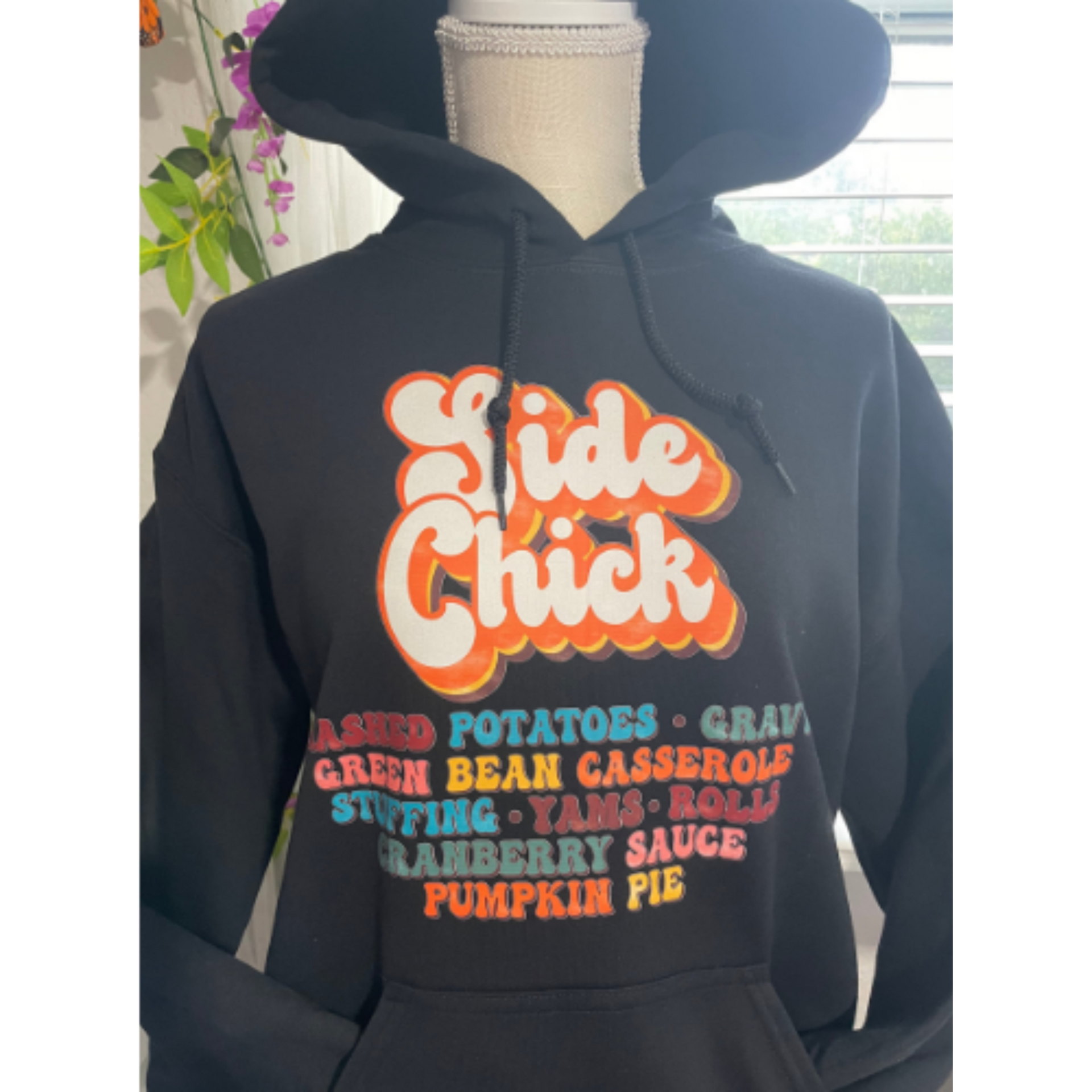 Black hoodie with orange “Side Chick” and fall food names printed on the front.