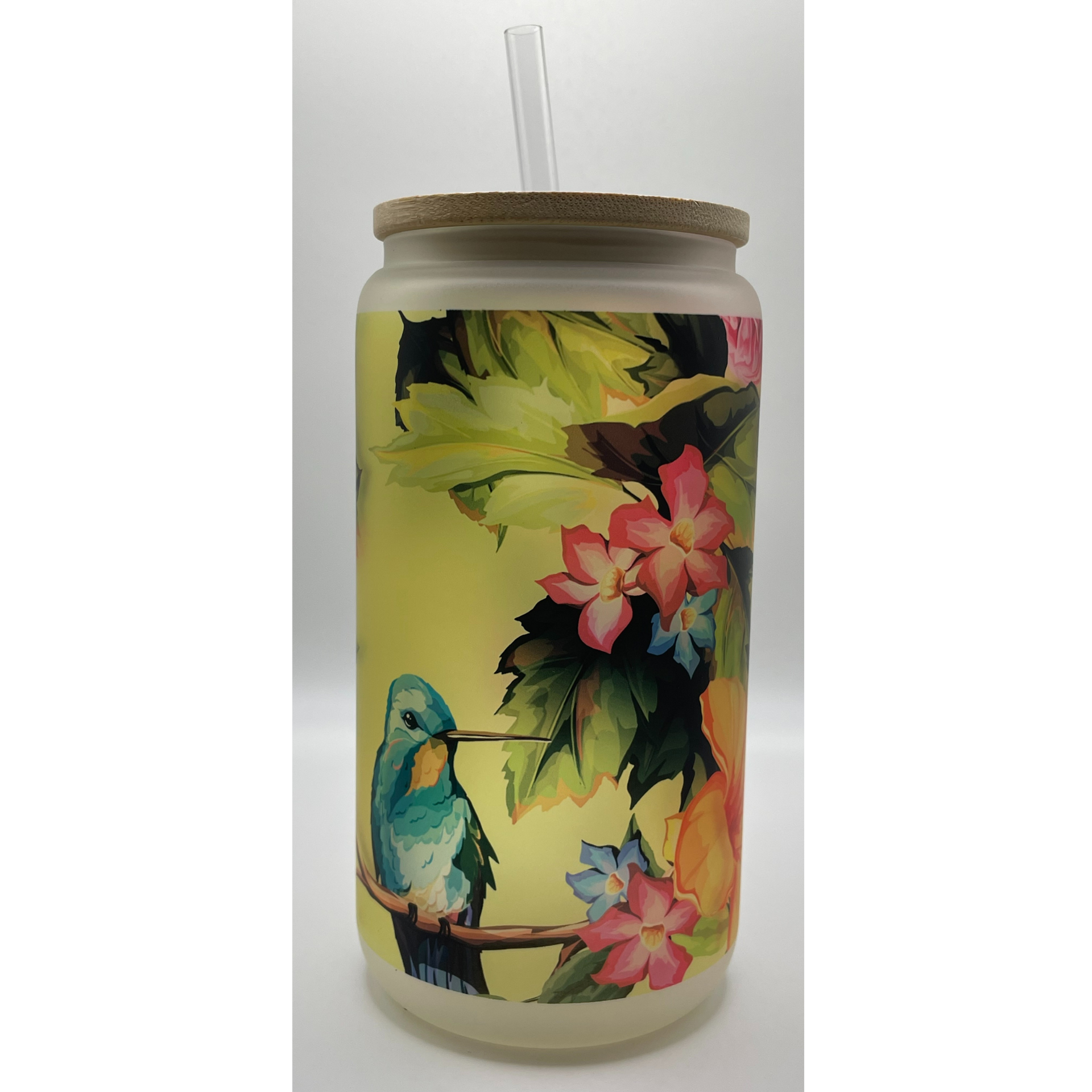 Tumbler with tropical floral and hummingbird print, clear straw, and cork lid