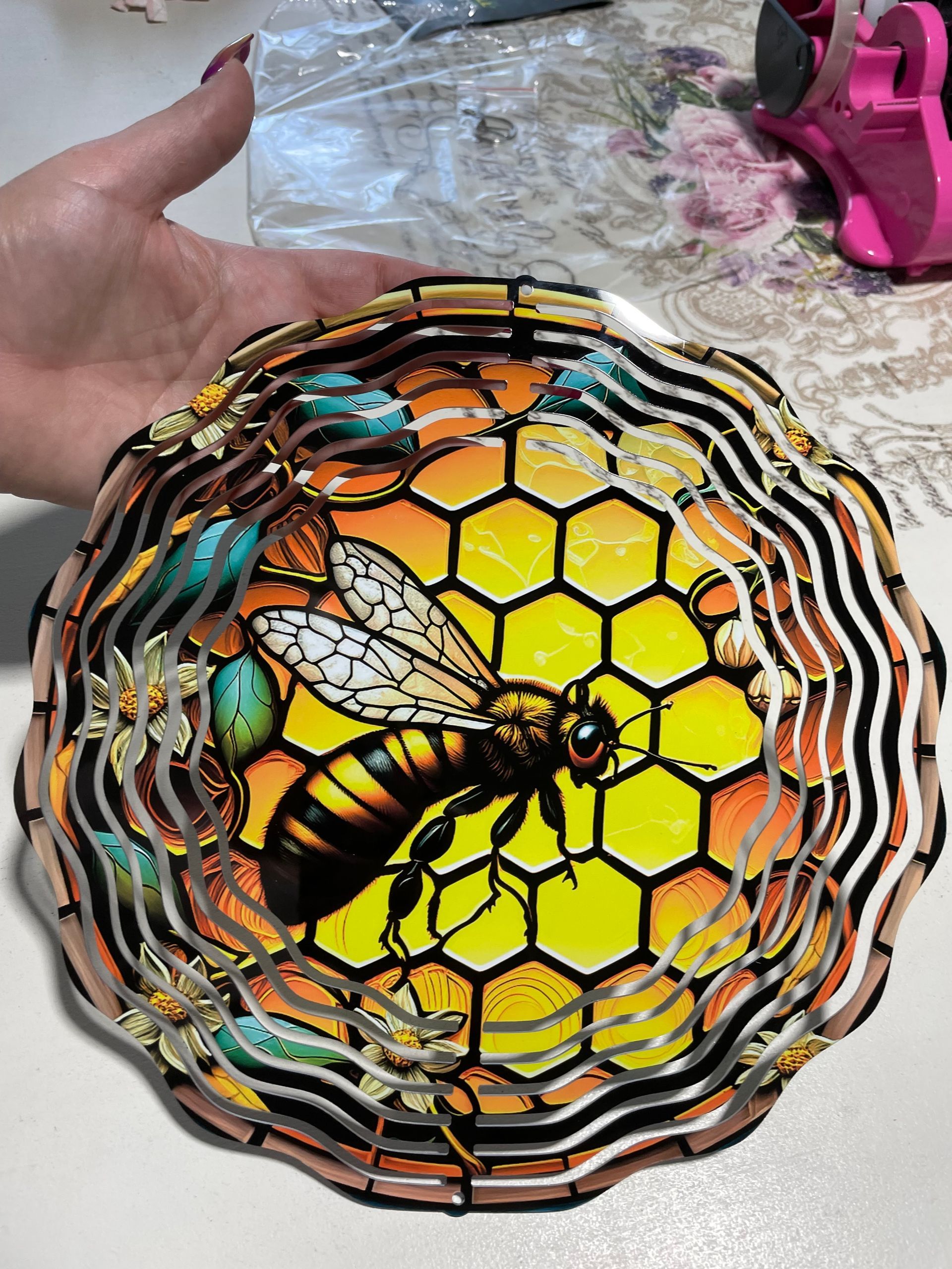 Hand-painted bee on a round woven basket with yellow honeycomb pattern
