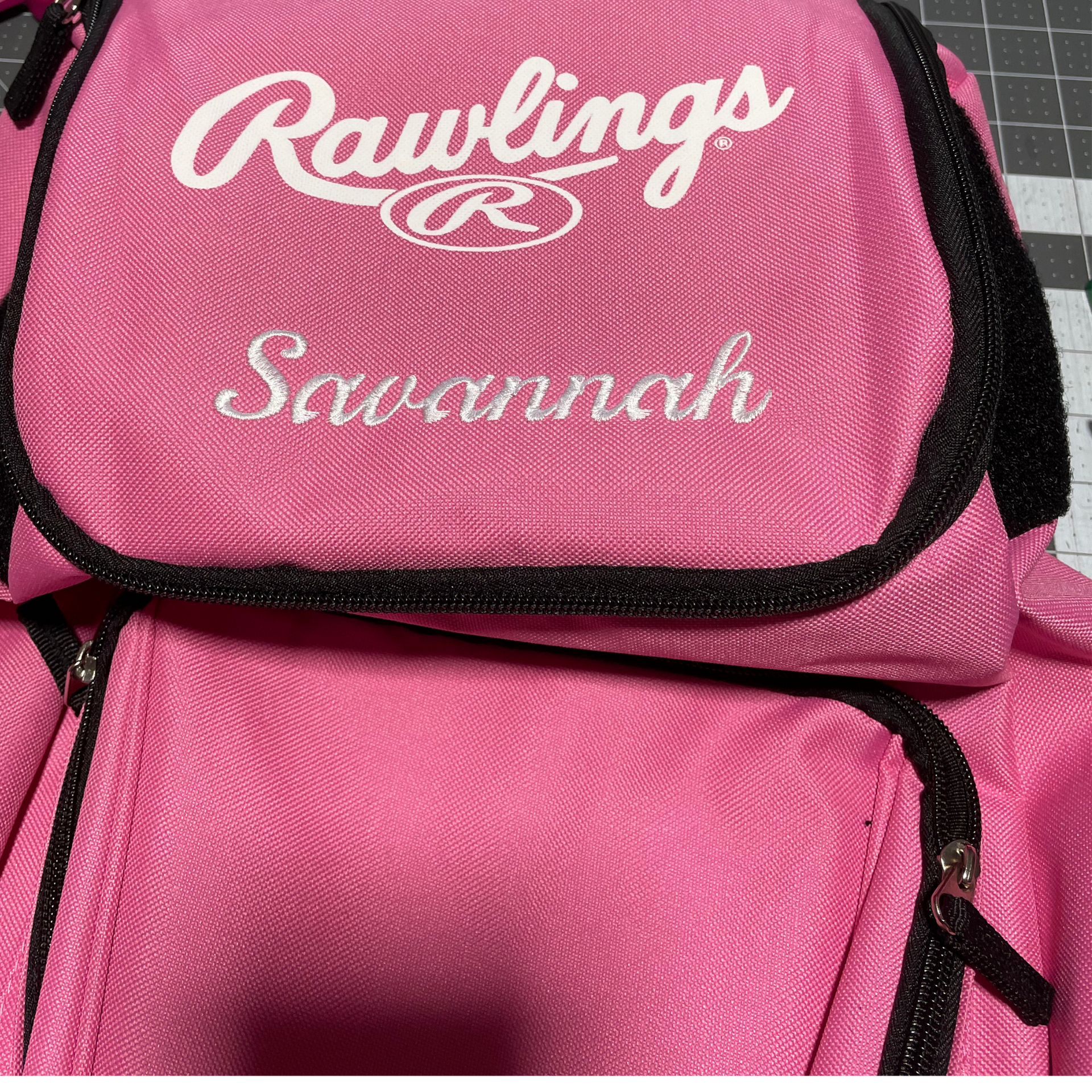 Pink Rawlings Savannah softball bag with black trim and white lettering