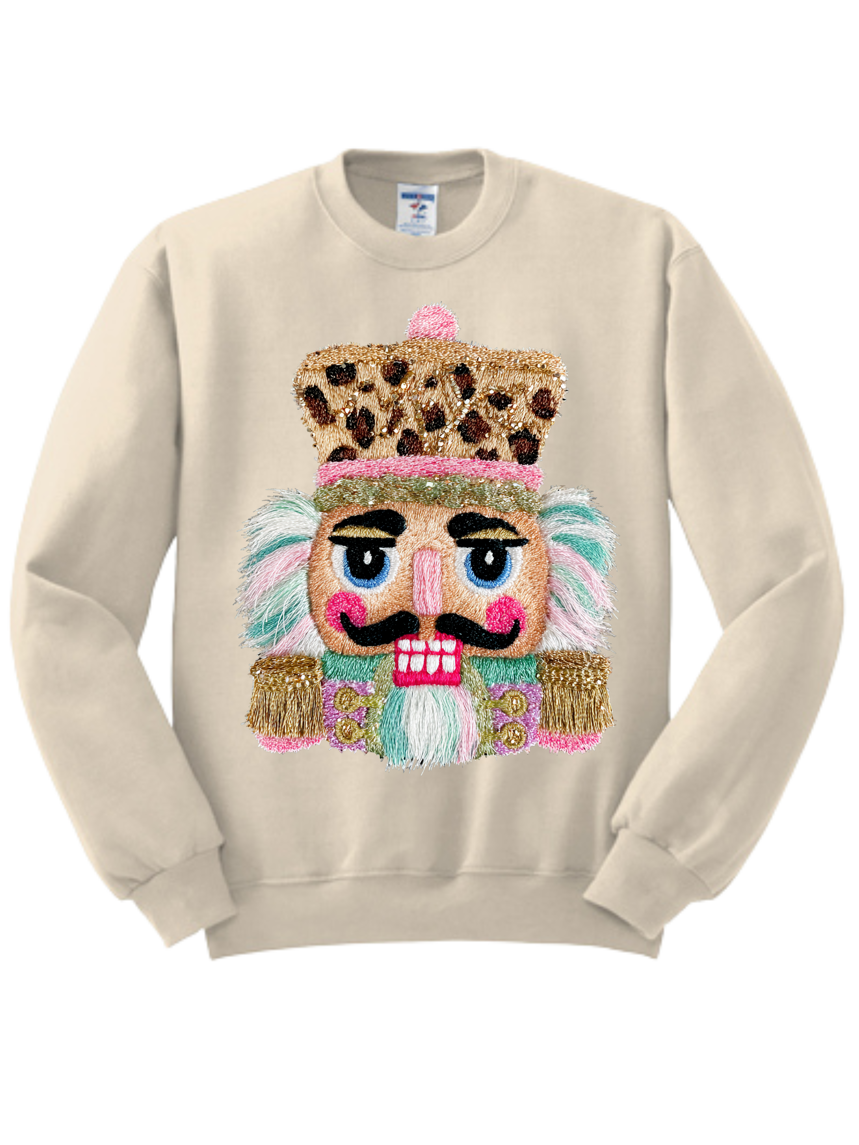 Beige sweatshirt with a colorful nutcracker face design on the front
