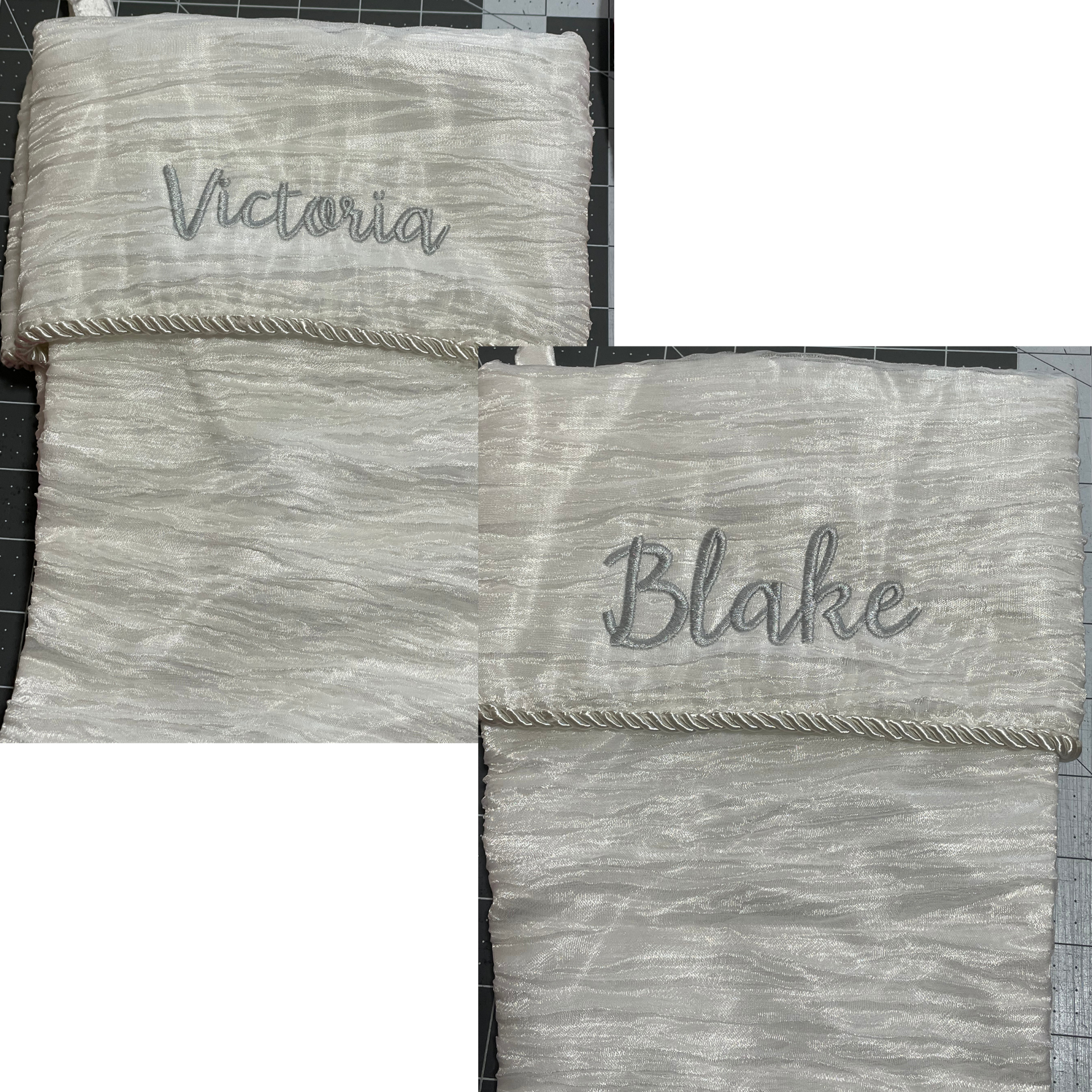 Two silver wrapped gifts labeled “Victoria” and “Blake” on a dark surface.