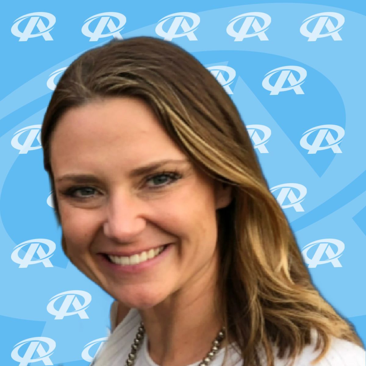 A woman is smiling in front of a blue background with the letter r on it