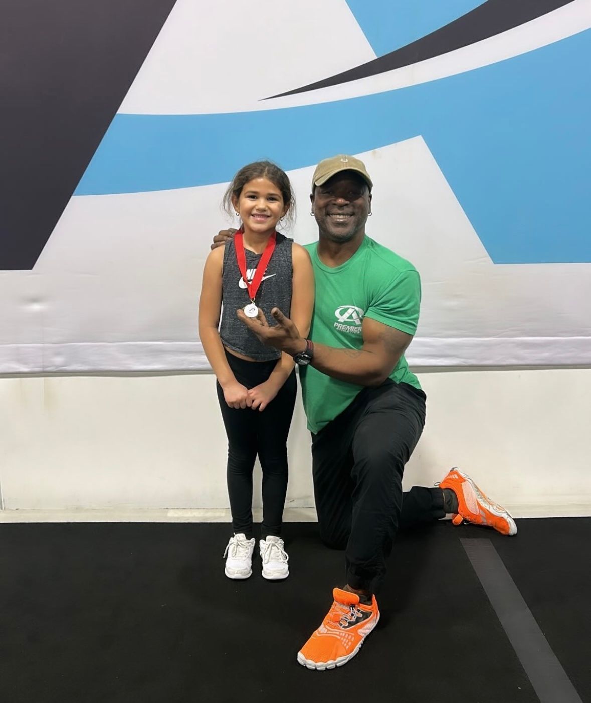 A man and a little girl are posing for a picture