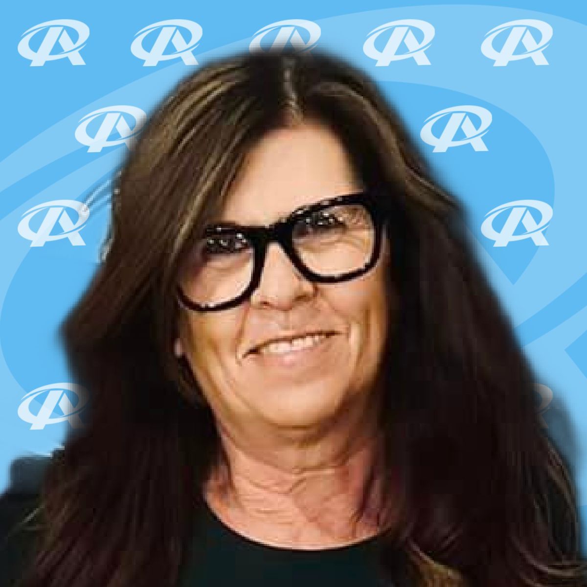 A woman wearing glasses and a black shirt is smiling.