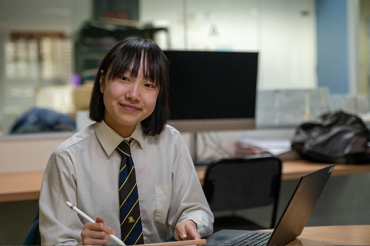 A student uses a pen and tablet at City Cite.