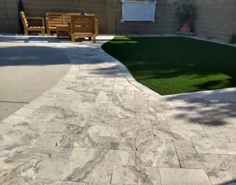 Landscape patio installation integrated into a landscaped residential yard