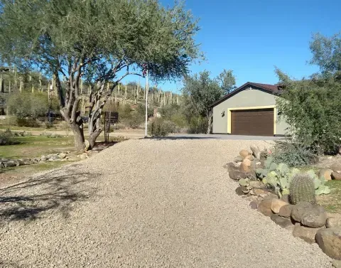 Decorative rock installation enhancing the appearance of a landscaped yard
