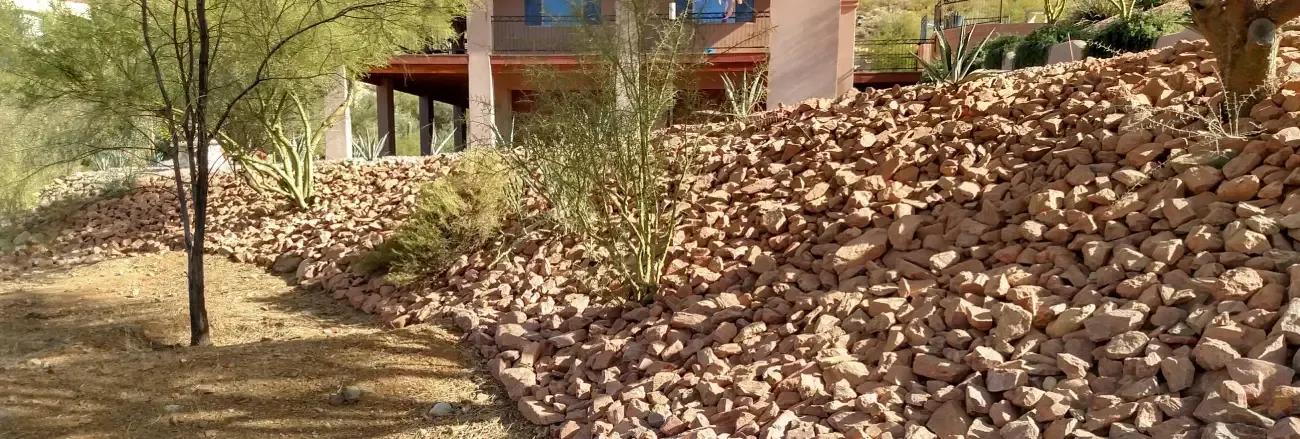 Grading and erosion control improving drainage and stability across a property